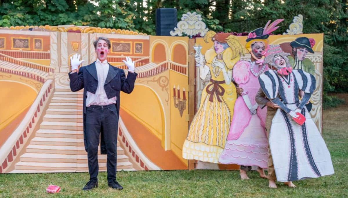 Alameda Post - String & Shadow Puppet Theater performs in flamboyant costumes with large colorful set pieces.