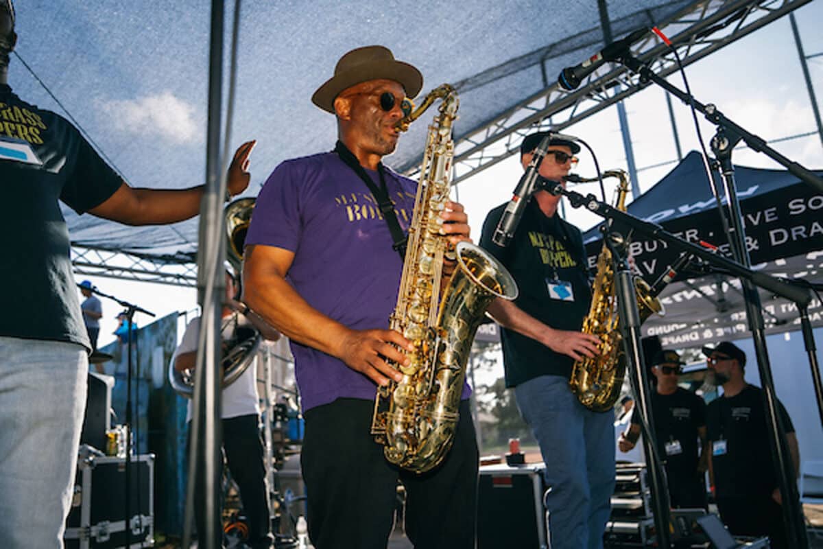 Alameda Post - A band with saxophones play onstage.
