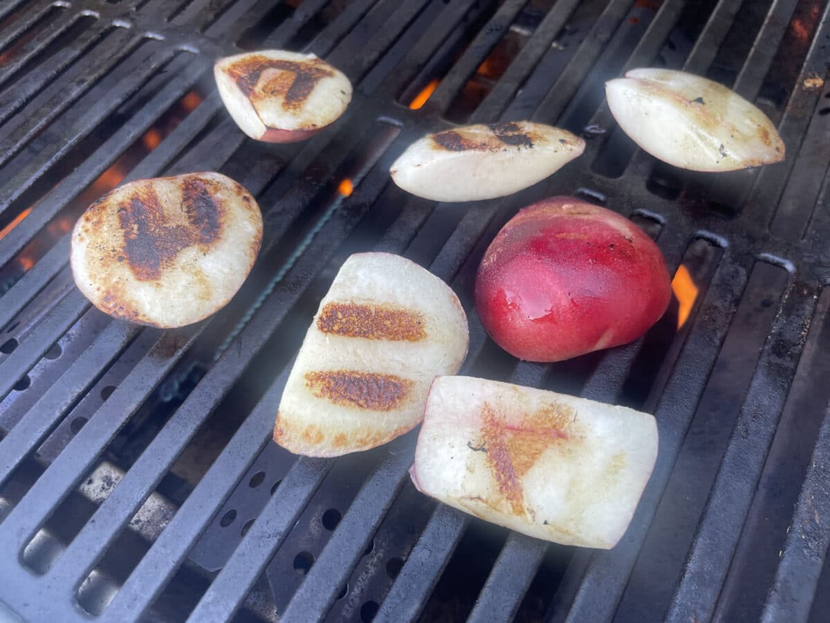 Alameda Post - Grilled nectarines on a grill. 