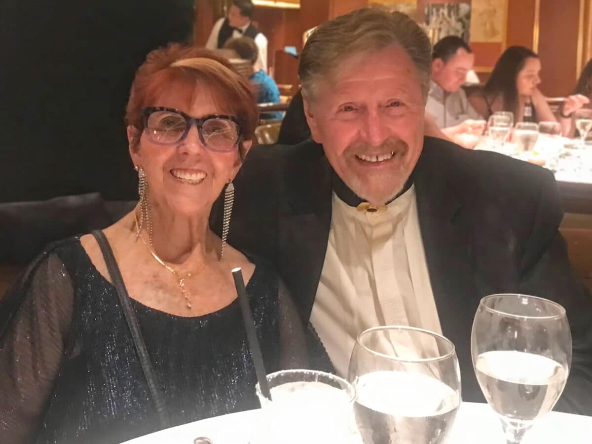 Alameda Post - two well dressed people at dinner