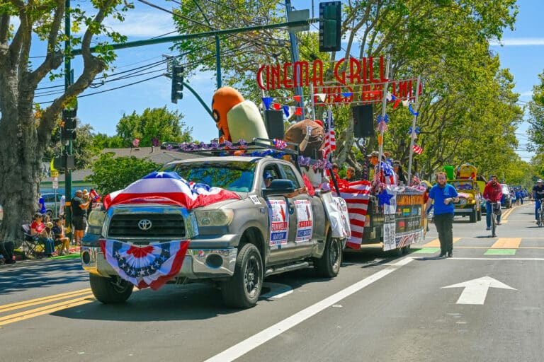 Alameda Post - A large pick up truck pulling a trailing decorated for the Alameda Theatre and Cinema Grill