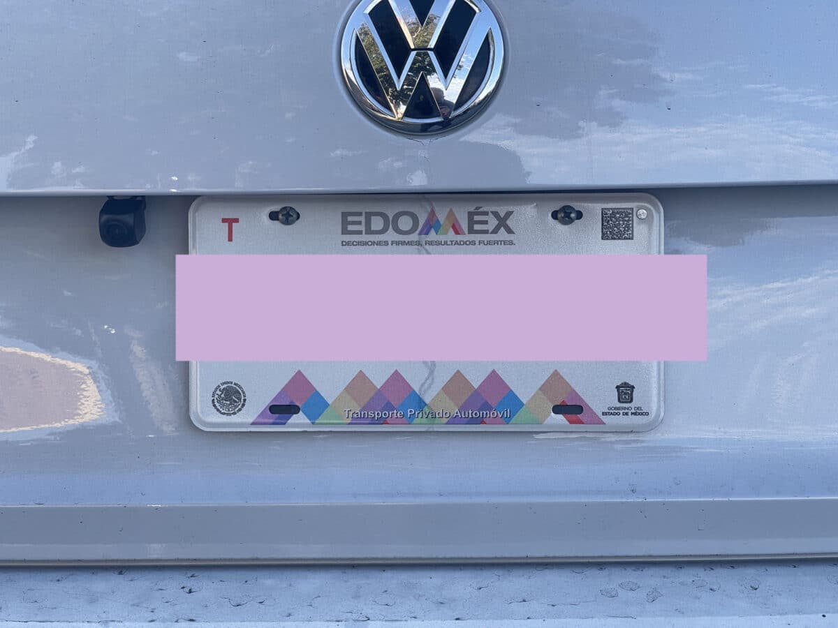 Alameda Post - A license plate with colorful geometric mountains. 