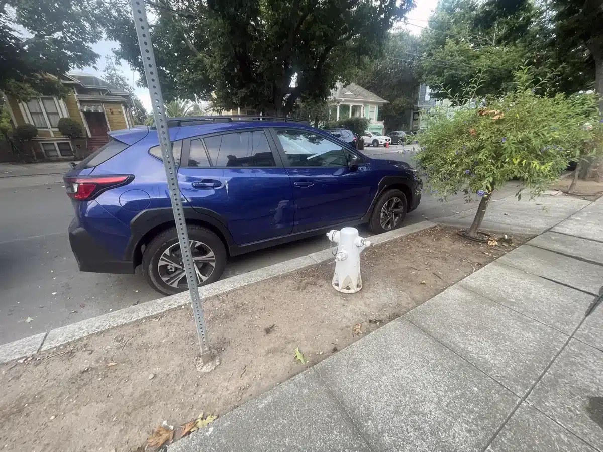 Alameda Post - a car parked in front of a fire hydrant