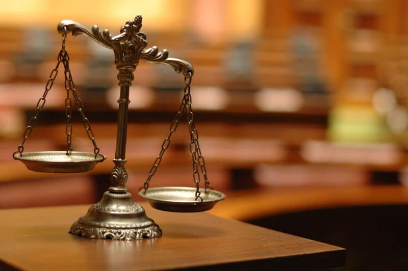 Alameda Post - The scales of justice in a courtroom.