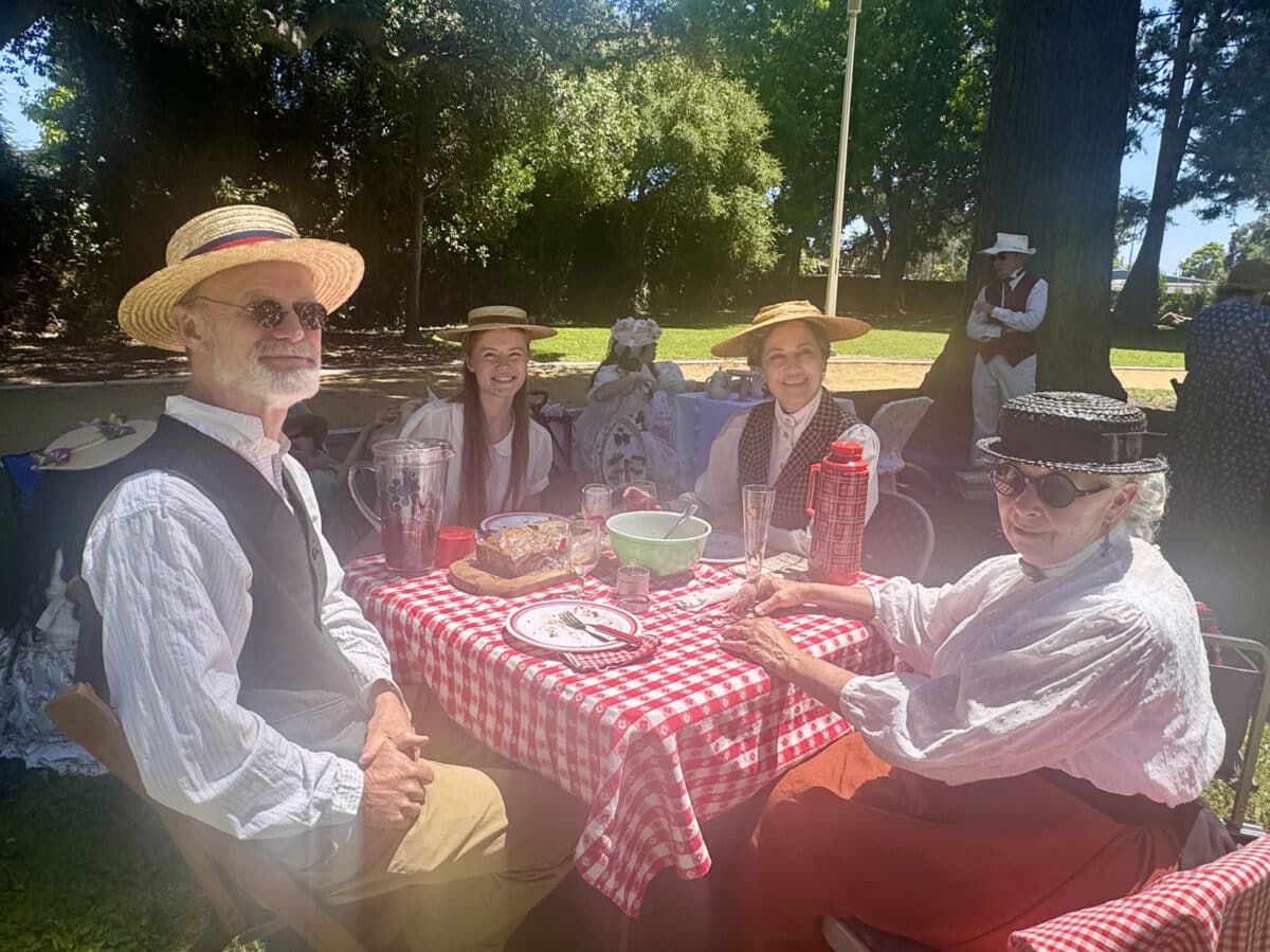 Alameda Post - Generations of a family sit around a small table, all wearing costumes, and enjoying the day at Lincoln Park.