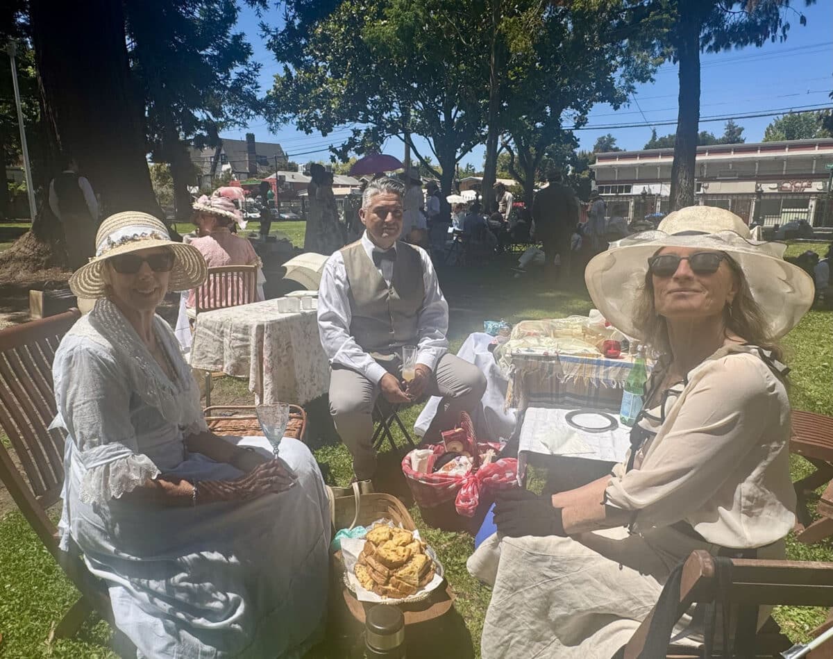 Alameda Post - Guests at the Period Events and Entertainment Society picic sit around in wooden lawn chairs and enjoy the day. 