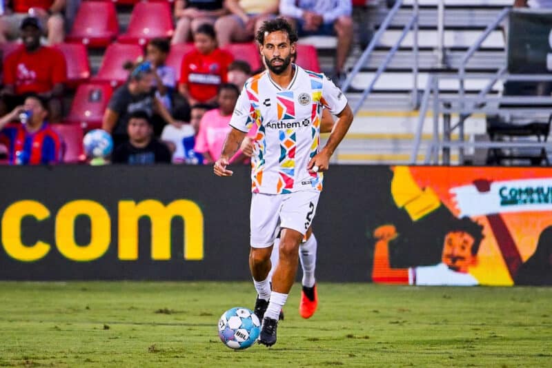Alameda Post - An Oakland Roots player dribbles the ball in a match against San Antonio FC.