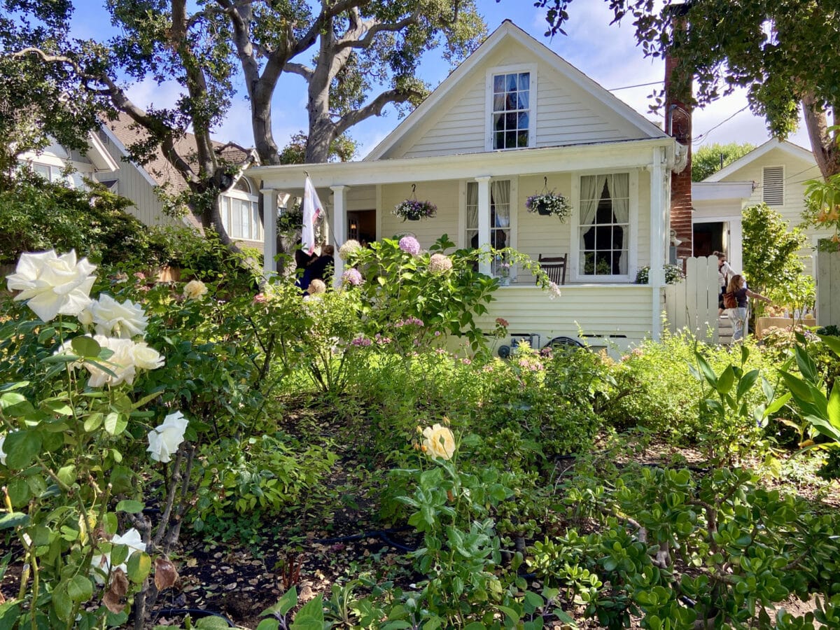 Alameda Post - The home at 1620 Fourth Street, a small cottage with a large front garden with roses.