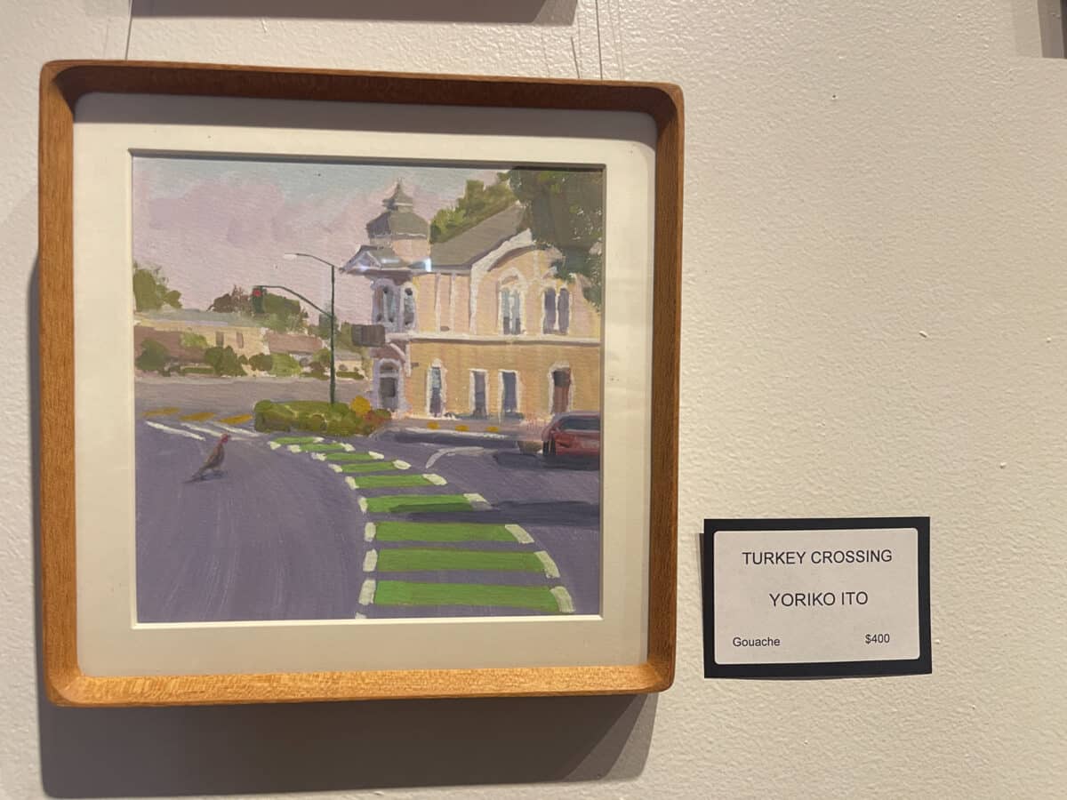 Alameda Post - A painting of the the High Street Station area and intersection in Alameda. A turkey is crossing the road.