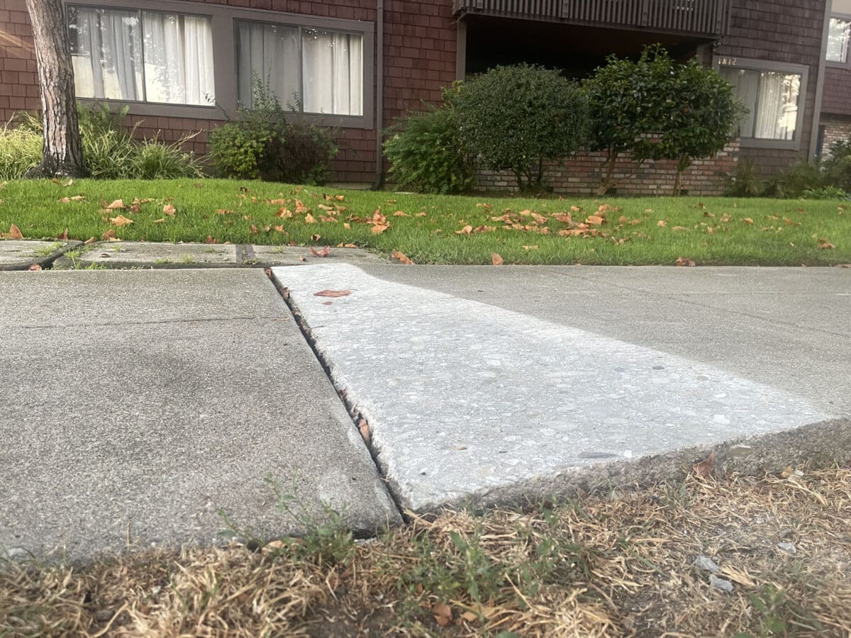 Alameda Post - A sloping sidewalk that has been shaved down to connect the two pieces more evenly. 