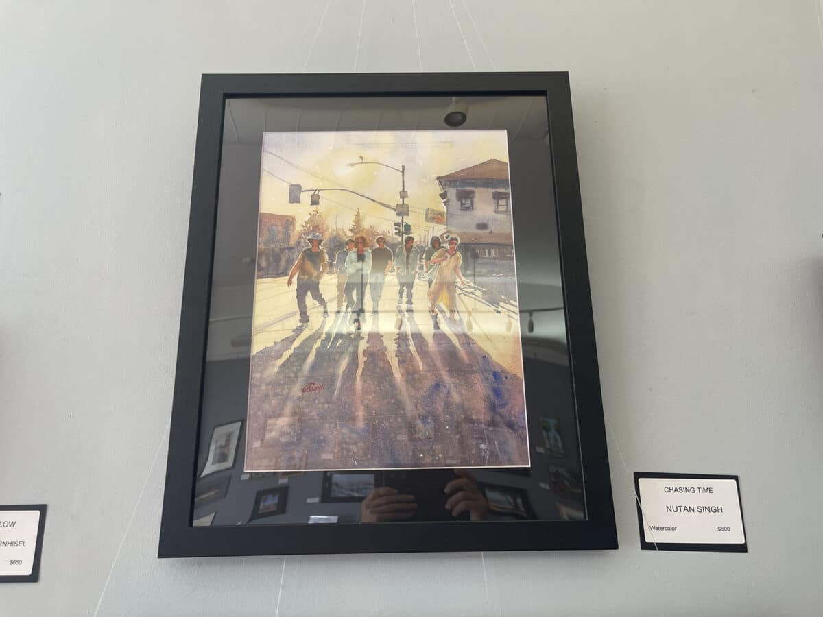 Alameda Post - A painting of a group of pedestrians crossing the crosswalk at Park and Central. The image is vertical, and their shadows extend towards the perspective.