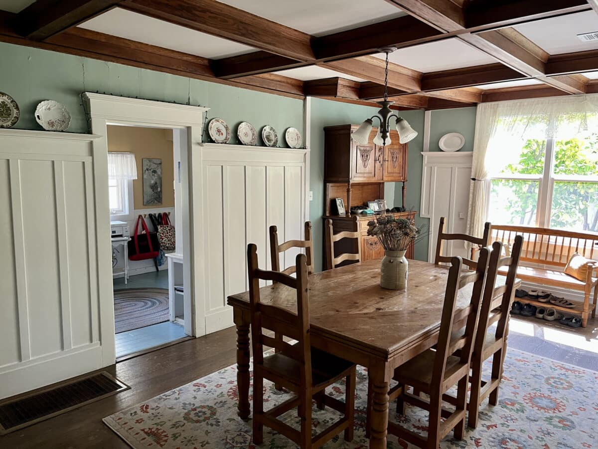 Alameda Post - A rich, old fashioned cottage living room with lots of dark wood and natural light.