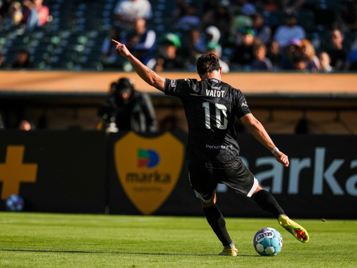 Alameda Post - An Oakland Roots player kicks the ball in the match against Orange County.
