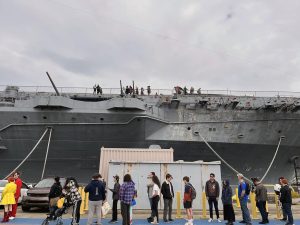 Alameda Post - 2025 Carrier Con attendees lined up outside the USS Hornet waiting to enter.