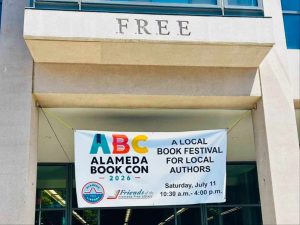 Alameda Post - The banner for Alameda Book Con hangs in front of the library.