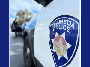 Alameda Post - a photo of a badge on an Alameda Police vehicle