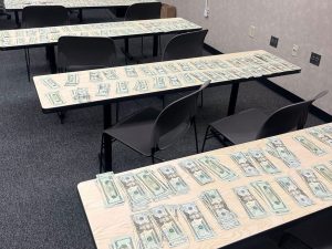 Alameda Post - tables with cash spread out over them.