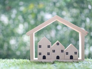 Alameda Post - an image of small wooden representations of apartments or houses
