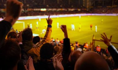 Alameda Post - Fans in a large soccer stadium cheer.