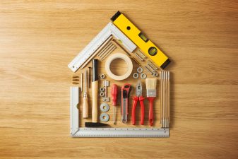 Alameda Post - A stock photo of home improvement tools arranged into the shape of a house.