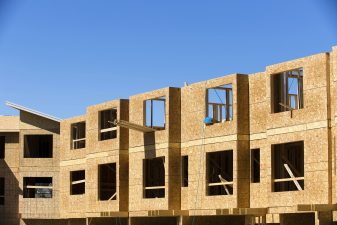 Alameda Post - Wooden frames of house apartment construction site using lumber