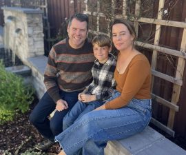 Alameda Post - Eric Schoeffler sits on a bench with a woman and young boy