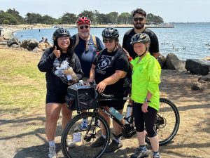 Alameda Post - 5 people in a group photo with Jenn Levine and her bike at the center