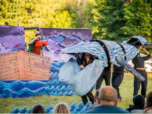 Alameda Post - Ship of Fools: A Giant Puppet Odyssey performance with performers in a boat and a very large puppet whale