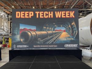Alameda Post - A large poster for Deep Tech week in an industrial building.