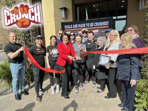 Alameda Post - the mayor cuts a red ribbon at Alameda's new Crunch Fitness location
