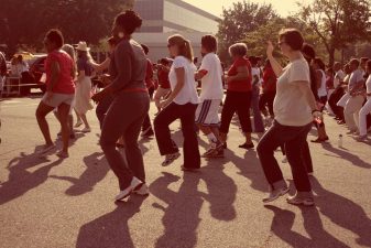 Alameda Post - A group of people dancing to stay healthy