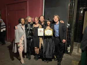 Alameda Post - six members of the Altarena Playhouse stand with awards and smile